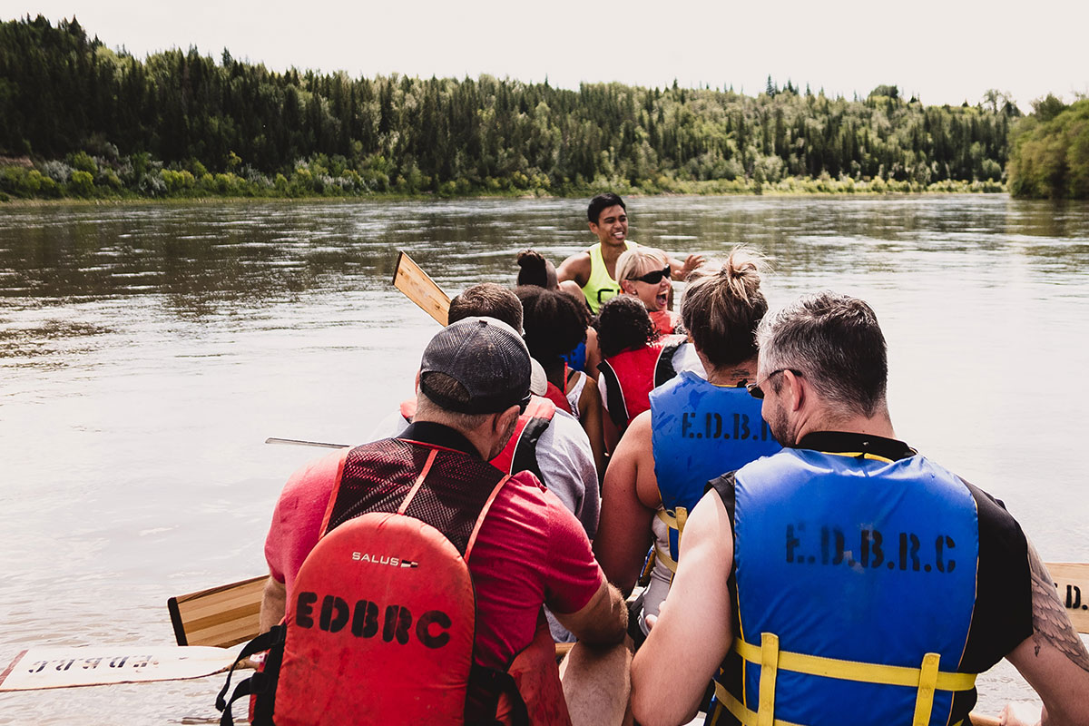 The Muscle Matters team in a dragonboat, on Edmonton's North Saskatchewan River