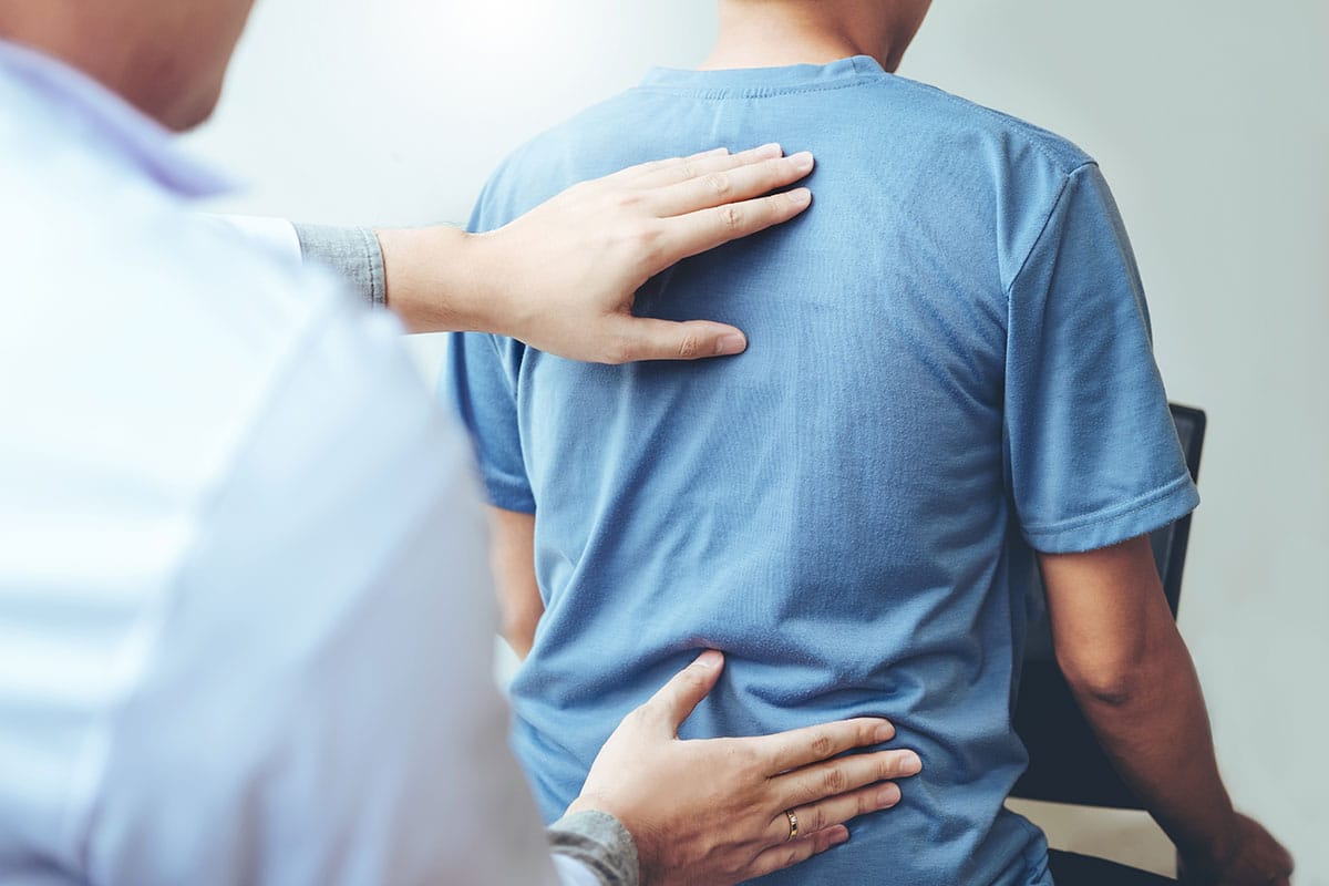 A man receiving a massage on his back