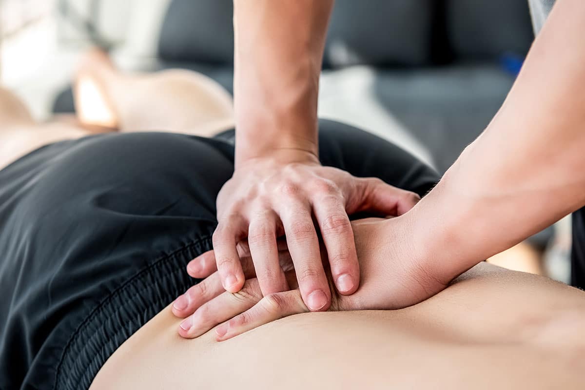 Man receiving a massage from a RMT